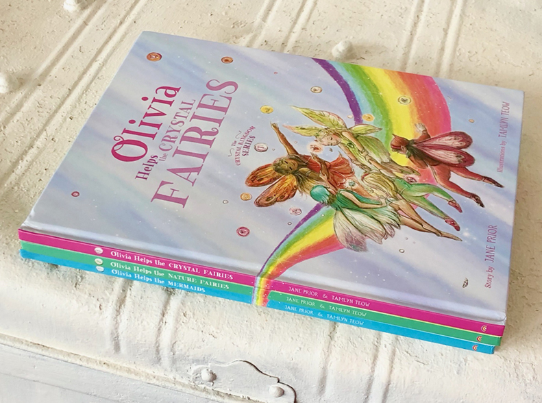 stack of three books with fairies on the cover